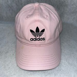 Baby pink adidas originals hat. It is a baby pink with black accent color